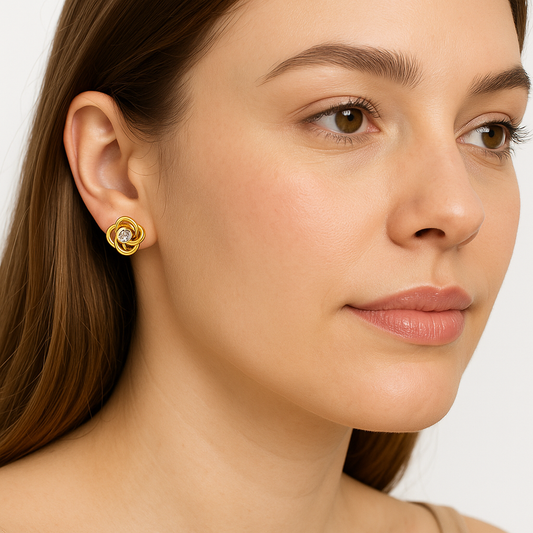 Topos en oro con diamante estilo entrelazado